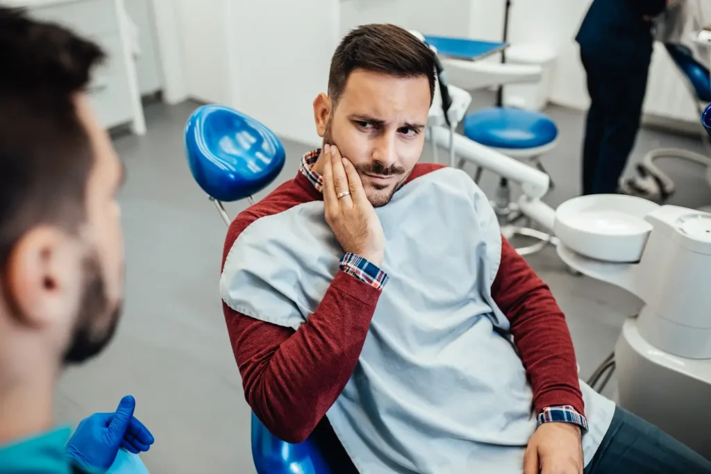 pacjent z bólem zęba